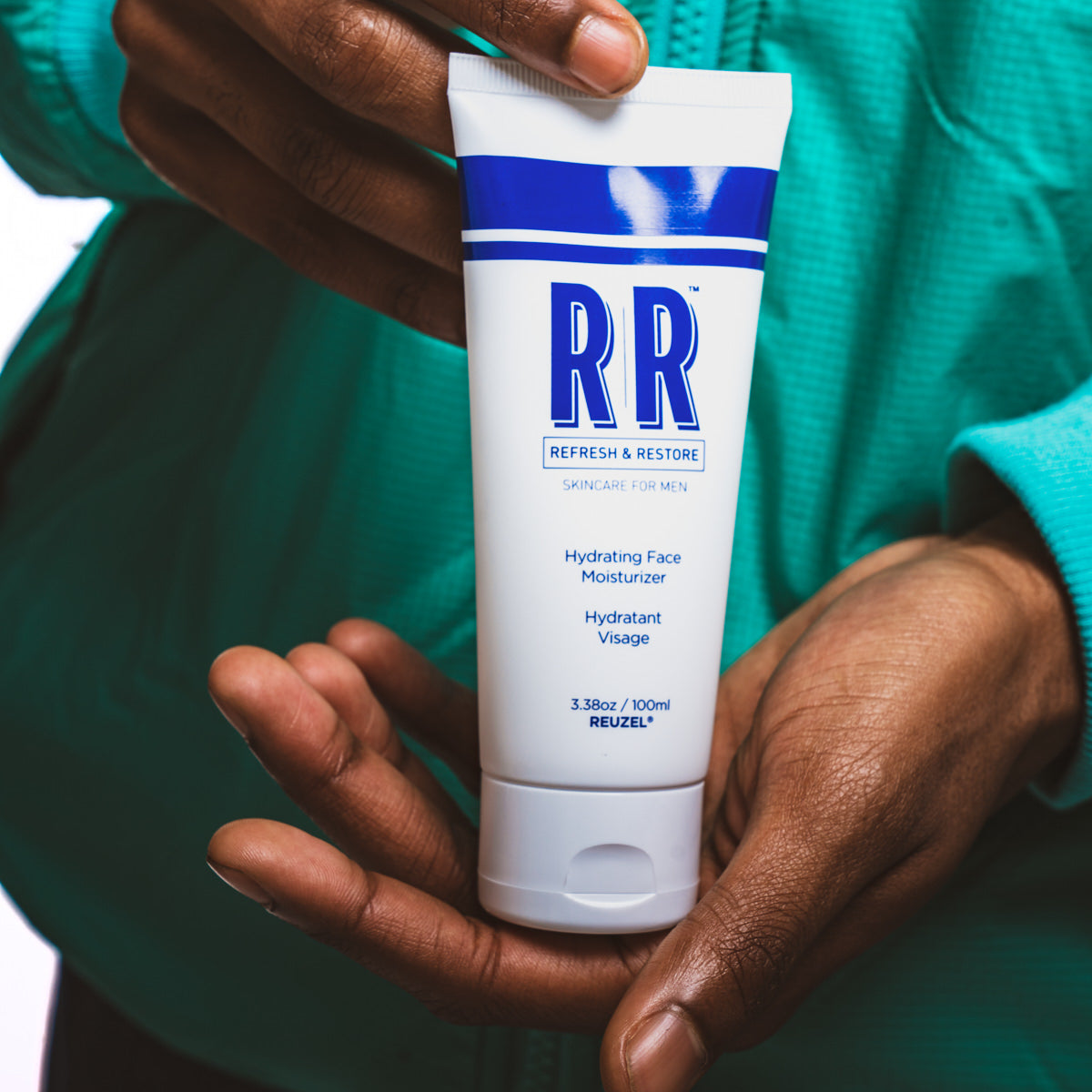 Reuzel UK skincare duo gift set featuring moisturizer and skincare products in sleek packaging.
