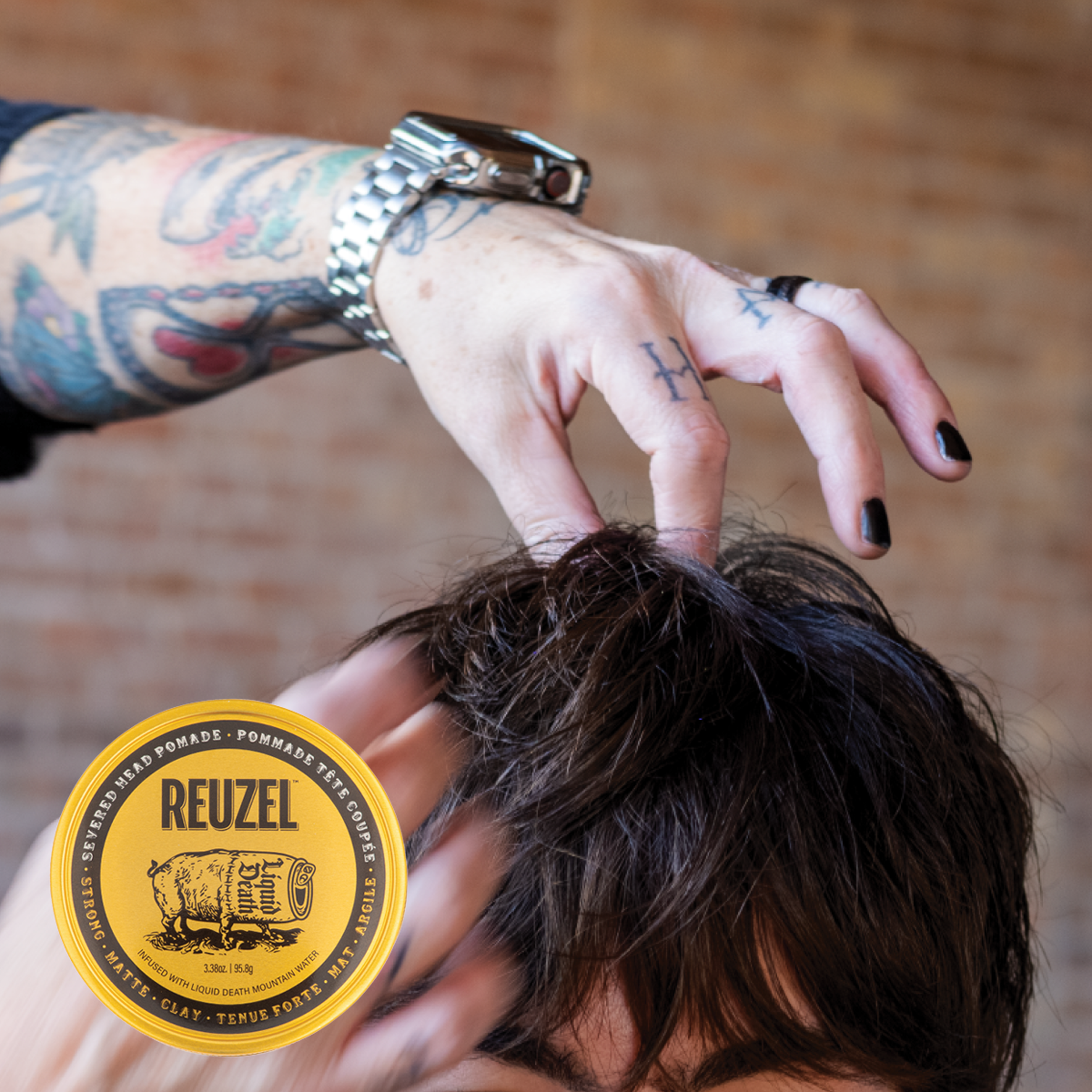 Reuzel x Liquid Death Severed Head pomade jar with label, featuring a graphic severed head illustration and bold branding.