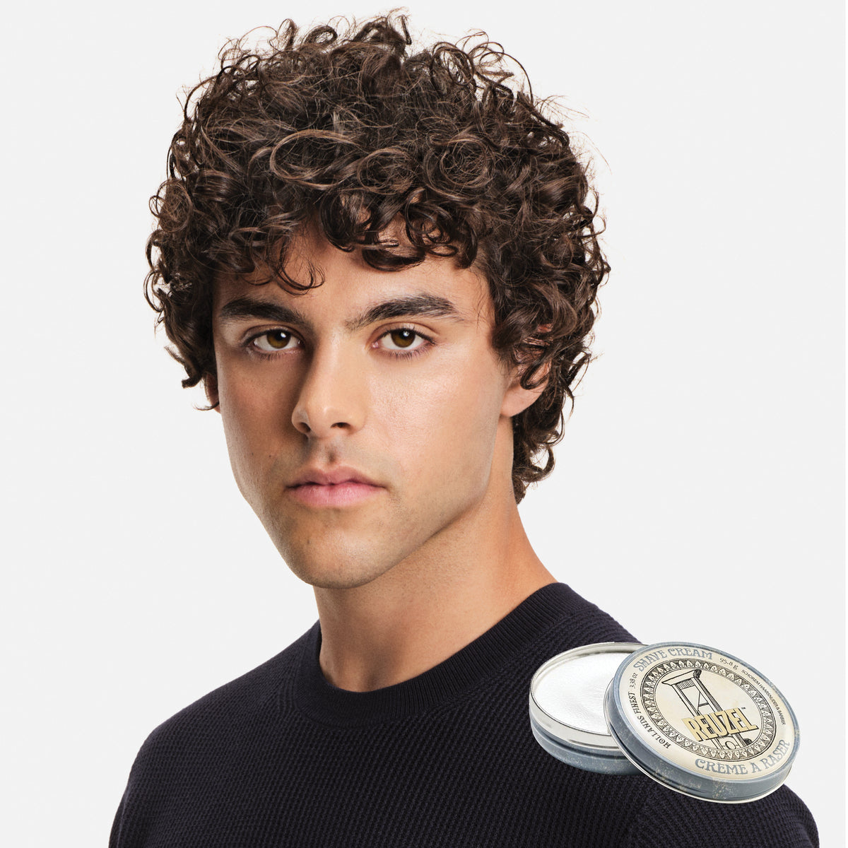 Reuzel UK shave cream in a jar with a creamy texture, suitable for smooth, close shaves and skin protection.
