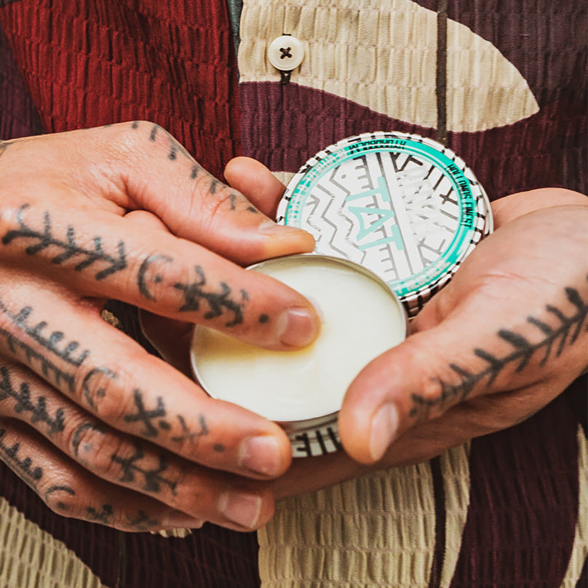 REUZEL UK TAT HYDRABALM tattoo aftercare balm in a white jar, suitable for soothing and moisturizing fresh tattoos.