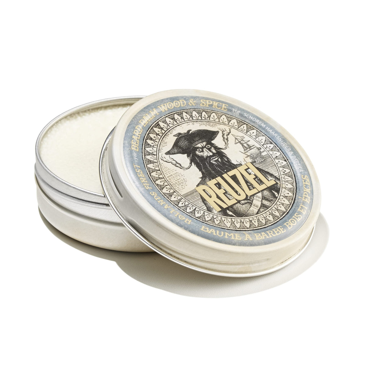 Reuzel UK Wood & Spice beard balm jar with label, natural wood scent, and product details on the packaging.
