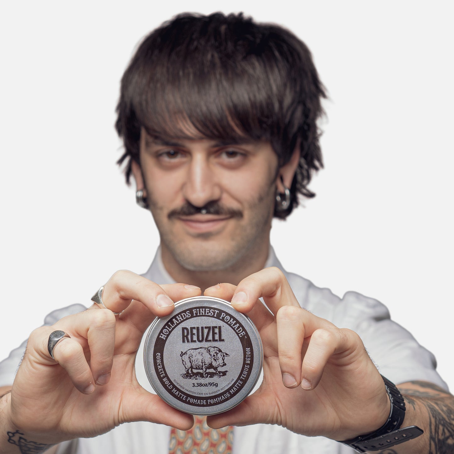 UK REUZEL Concrete Hold Matte Pomade in a jar, showing its thick, matte-textured styling product with a black label and lid.