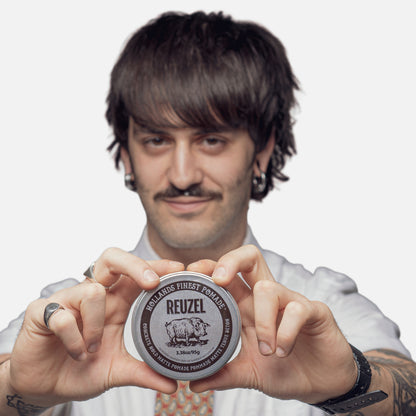 UK REUZEL Concrete Hold Matte Pomade in a jar, showing its thick, matte-textured styling product with a black label and lid.