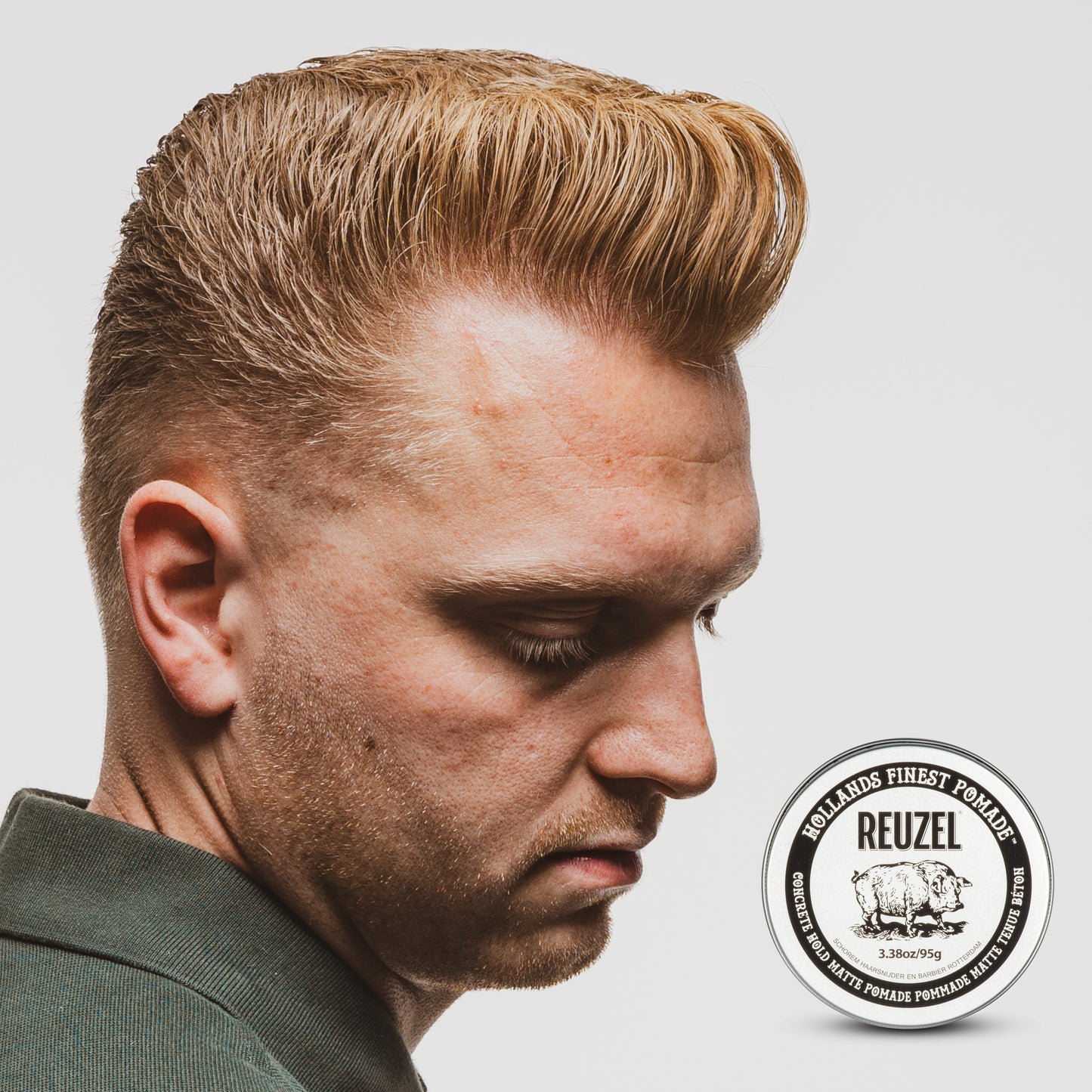 UK REUZEL Concrete Hold Matte Pomade in a tub, showing the black and gray packaging with the product label visible.