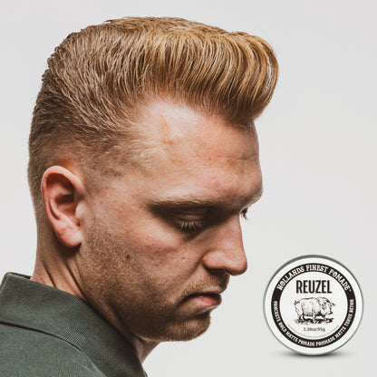 UK REUZEL Concrete Hold Matte Pomade in a tub, showing the black and gray packaging with the product label visible.